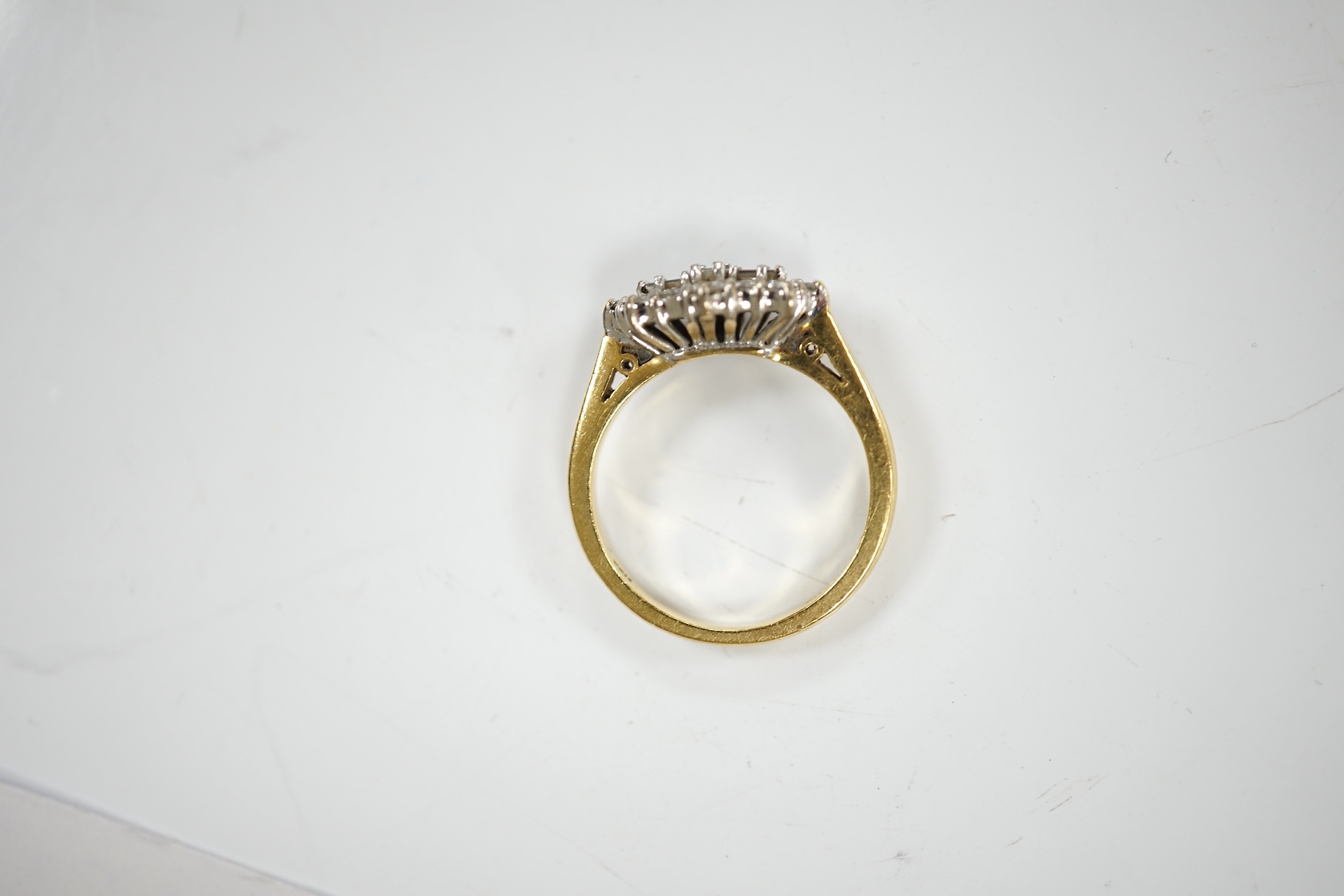 A modern 18ct gold and diamond cluster ring, size K, gross weight 4.4 grams. Condition - fair to good